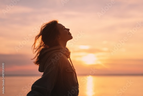 Embracing Serenity: A Silhouette of Contemplation Against a Stunning Sunset Over Tranquil Waters, Invoking Peace and Reflection