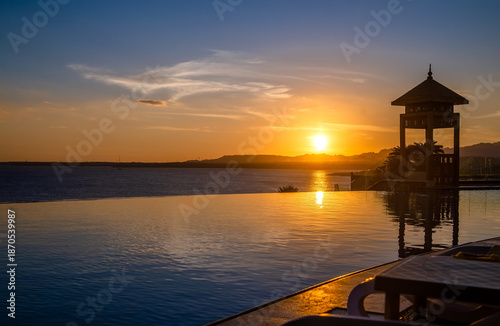 Sunset over the pool overlooking the sea