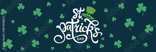 Elegant white hand-drawn calligraphy "St. Patrick's Day" with a cheerful green leprechaun hat atop, set against a deep navy blue background adorned with scattered green shamrocks.