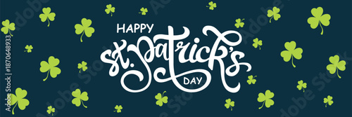 Elegant white hand-drawn calligraphy "St. Patrick's Day" with a cheerful green leprechaun hat atop, set against a deep navy blue background adorned with scattered green shamrocks.