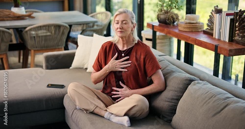 Breathing, meditation and senior woman on sofa in home with calm, relax or peaceful balance. Yoga, spiritual and elderly female person with grounding ritual in morning in living room at house.