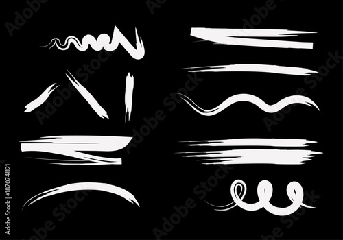 Colección de trazos y pinceladas blancas de estilo artístico sobre un fondo negro sólido