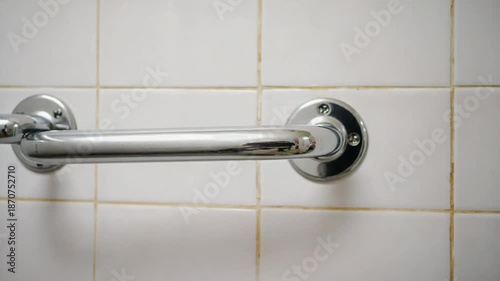 Safety grab bar in a bathroom for senior people.