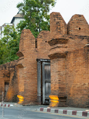 Historic brick wall and gate structure of Tha Phae Gate in Chiang Mai