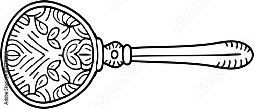 decorative magnifying glass with ornate handle and intricate floral design pattern