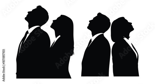 Four people looking upwards in a striking black silhouette
