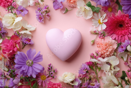 Wallpaper Mural Heart surrounded with fresh colorful flowers on pastel pink background. Creative love layout with copy space. Valentines day, wedding or romantic visual trend. Spring bloom. Flat lay. Torontodigital.ca