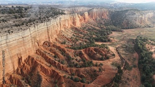 Aerial drone view of hiking in the red canyon of Teruel, landscape erosion
