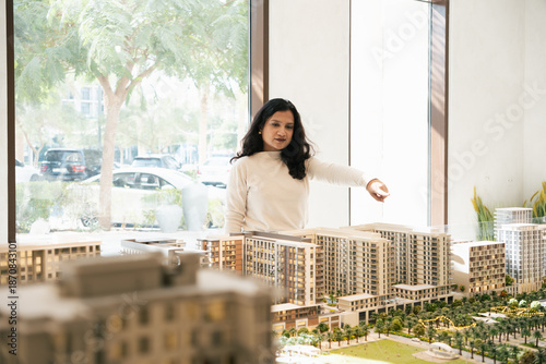 Photography Real estate sales professional explaining premium housing project with housing m