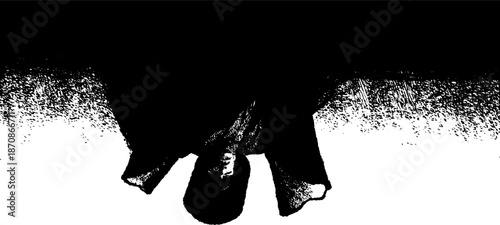 Abstract silhouette of cloaked figure in high contrast black and white