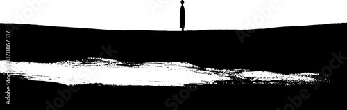 Abstract silhouette of solitary figure on hillside at sunrise