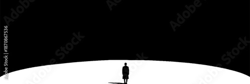 Silhouette of a solitary figure under vast black sky