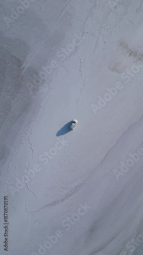 Top-Down Drone Shot of Car Centered on White Rann Salt Desert