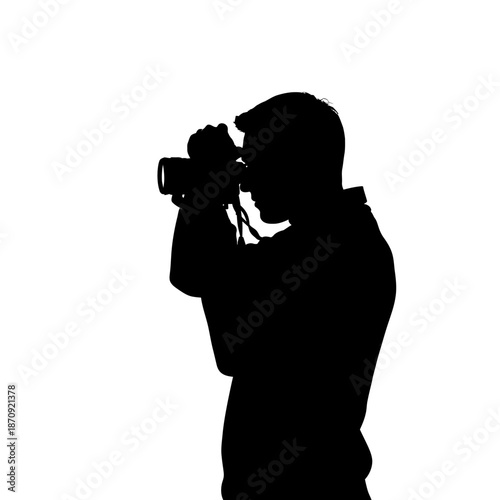 Silhouette of a Photographer Holding a Camera Ready to Shoot.