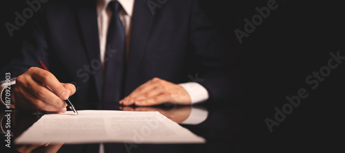 Close up lawyer working and signing agreement