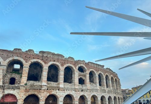 Colosseo in Verona, Italy close-up across blue sky and other architecture. Ancient Roman architecture