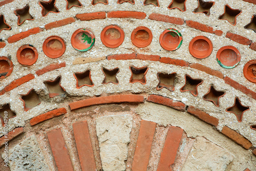 Quadro em tela Detailed view of the intricate Byzantine opus mixtum masonry and decorative ceramic inserts on the exterior facade of the historic St
