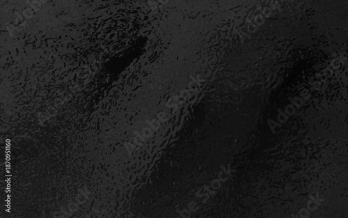 This dark foil glass texture showcases a shiny metallic surface with a rough, and subtle gradient light reflections. Perfect for luxury branding, grunge designs, posters, product mockups.