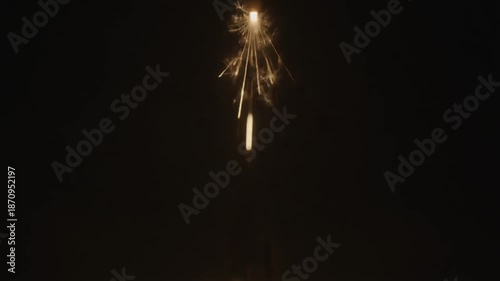 Spark shower against dark backdrop