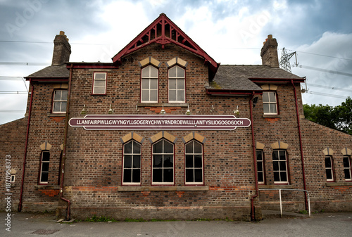 Name Plate On Trainstation Building Of Villag Llanfairpwllgwyngyllgogerychwyrndrobwllllantysiliogogogoch in Wales, UK