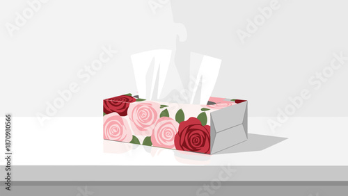 Stylish tissue box adorned with a beautiful rose floral pattern in red and pink, presented on a minimalist white surface for a clean aesthetic.