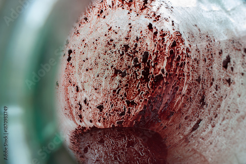Tableau sur toile Wine precipitate in a bottle, used yeast.