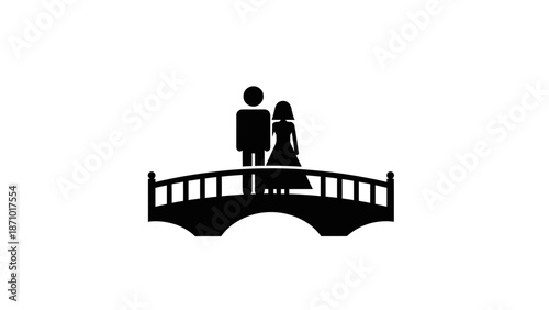 Couple stands on small bridge in romantic evening setting outdoors