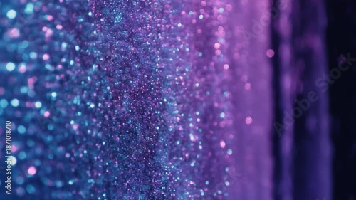 A vibrant purple and cyan macro shot of shimmering glitter texture, creating a festive bokeh effect against a dark abstract background, perfect for a snowflake png overlay.