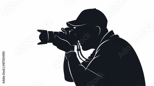 Silhouette of a photographer holding a camera and taking a picture.