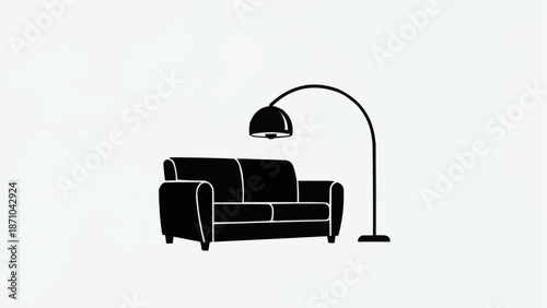 Modern black sofa with a sleek arc floor lamp.