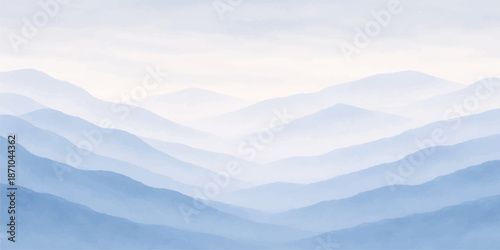 A breathtaking morning landscape featuring a misty mountain range under a blue sky at sunrise with a snow covered forest valley hidden in the clouds