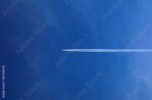 blue sky with jet airplane contrail condensation trail