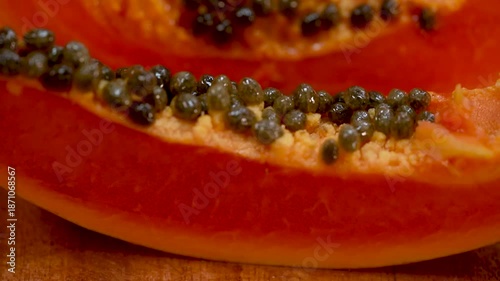 Focused Shot of Ripe Red Papaya Flesh and Peppery Seeds.