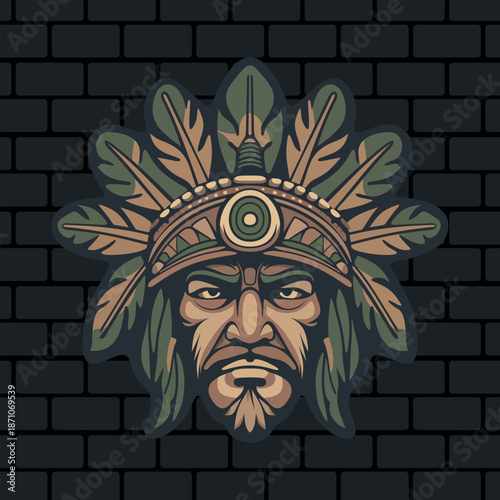 a stern face of a tribal Indian warrior or deity with stylized leaves on his head depicted on a brick wall