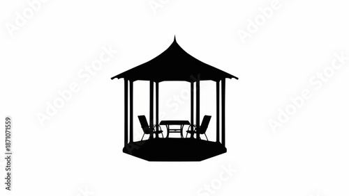 Silhouette of a garden gazebo with chairs and table.