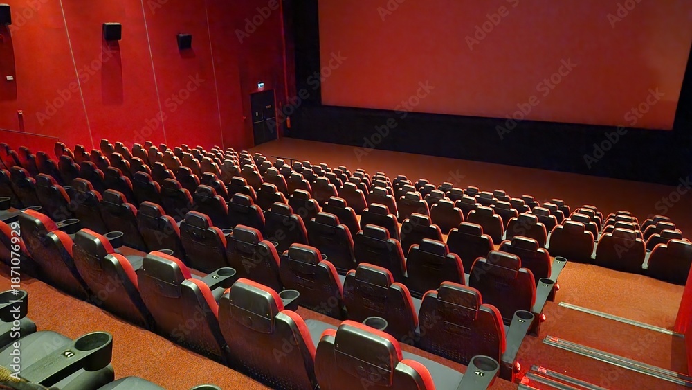 Naklejka premium red movie theater, white screen and seats