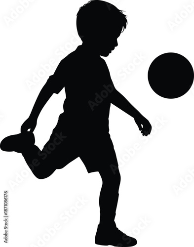 Silhouette of a child kicking a ball in motion