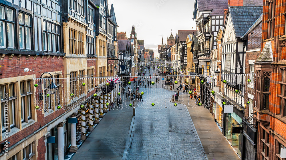 Naklejka premium A view from the city walls west up Eastgate Street in the city of Chester, Cheshire, UK