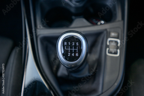 Six speed manual gear stick in car interior