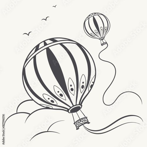 Black and white of two hot air balloons flying in the sky with birds
