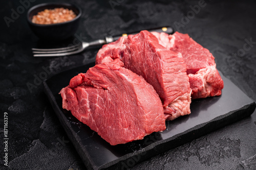 Fotografie Raw beef boneless shank shin presented with herbs and spices, inspiring bold flavors and unique recipes for adventurous home cooks