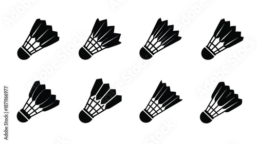 A collection of black badminton shuttlecocks presented as a striking silhouette