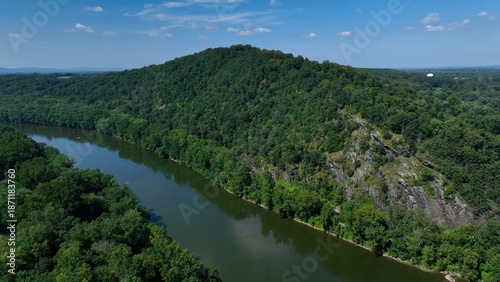 Mountain side with cliffs beside the Potomac River at Point of Rocks, Maryland in summer 