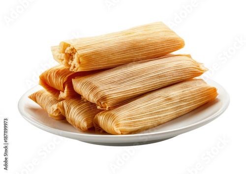 A stack of golden tamales on a white plate