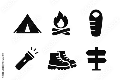 Camping essentials: silhouette icons of tent, campfire, sleeping bag, and more