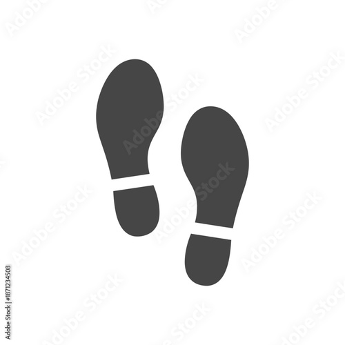 Two dark grey footprints with white stripes indicating direction.