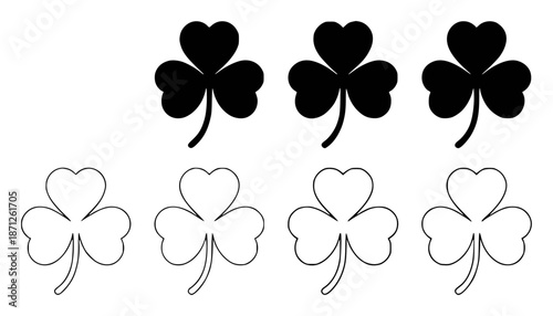 Solid black shamrocks and outlined shamrocks white clover leaf