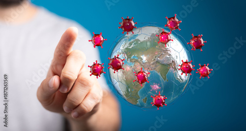 Tableau sur toile Conceptual image of a finger pointing at a virus outbreak surrounding the globe,