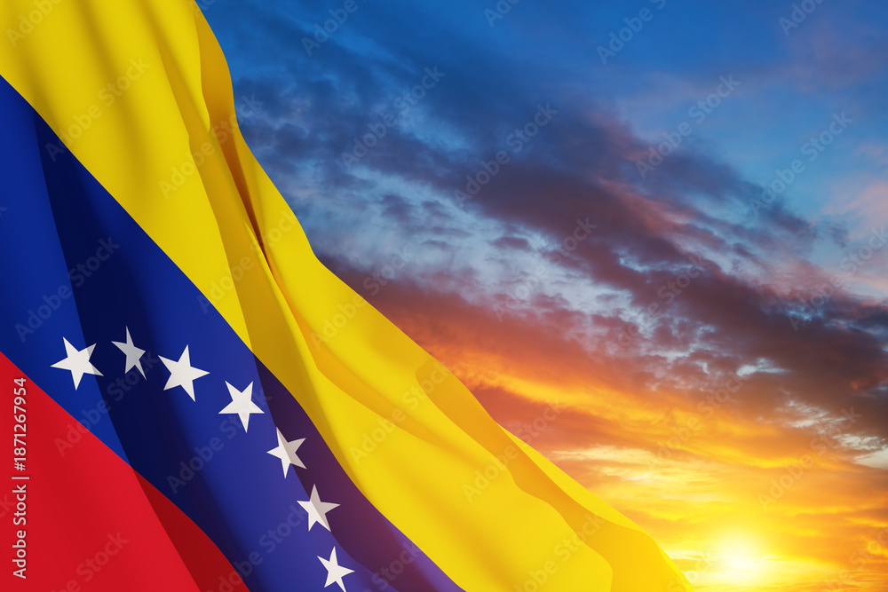 Fototapeta premium Venezuela flag on background of sunset sky. Patriotic concept. Banner with place for text.