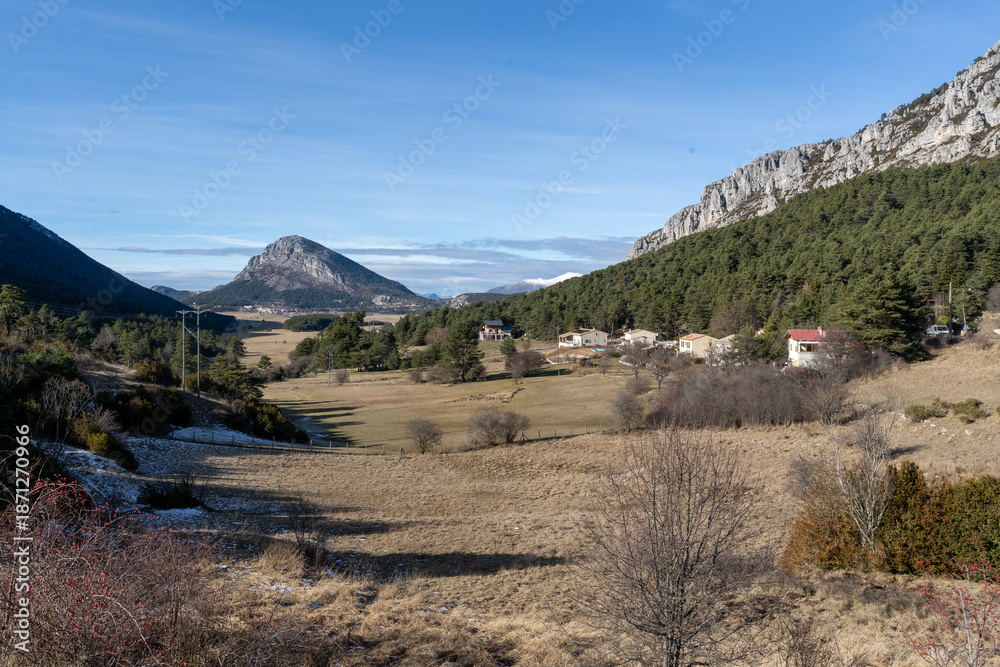 Fototapeta premium Rock formation at the end of valley, meadow. High quality photo